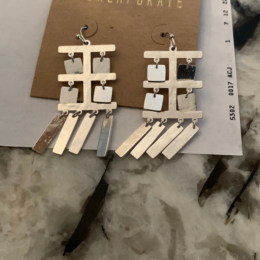 Cute earrings. Looks like Chinese symbols